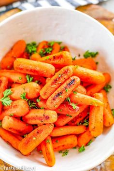 carrots with parsley in a white bowl on a table