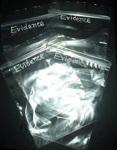 three clear plastic envelopes with the words evidence on them