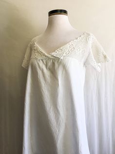 "Beautiful antique Edwardian romper with button crotch and beautiful crochet lace yoke. ~lightweight cotton ~crochet lace ~button crotch ❉ measurements: Measured Flat bust: 37\" waist:44\" length: 33.5\" from high point shoulder to hem end of sleeve to other end of sleeve: 27.5\" brand/maker:N/A material:cotton, crochet lace condition: Great ❉ All items are vintage and have been worn and loved, some small flaws may go unnoticed. I promise to include every detail of every garment accurately." Summer V-neck Nightgown With Delicate Lace, Summer Lace Sleepwear With Lace Trim, Cottagecore Lace Trim Sleep Dress, Crochet Trim Lace Top For Summer Daywear, Cotton Crochet Top With Lace Trim For Daywear, Summer Crochet Lace Top With Lace Collar, Summer Lace Bedtime Tops, Lace Collar Top For Summer Daywear, Summer Lace Collar Top For Daywear