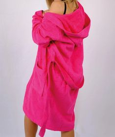 Step into comfort and vibrant style with our Fuchsia Bathrobe, crafted from 100% high-quality cotton. Perfect for relaxing at home, this bathrobe offers both functionality and a pop of color to your loungewear collection. Key Features: Premium Material: Made from 100% pure cotton, ensuring exceptional softness, breathability, and durability. Vibrant Design: The bold fuchsia color adds a lively and cheerful touch to your daily routine. Versatile Fit: Available in four sizes - S, M, L, and XL, designed to provide a comfortable and flattering fit for all body types. Easy Care: Machine washable for hassle-free maintenance and long-lasting use. Wrap yourself in the luxurious feel of this striking bathrobe and elevate your everyday relaxation. Perfect as a gift or a personal indulgence, this bat Cozy Cotton Robe For Loungewear, Casual Robe For Relaxation, Casual Cotton Robe For Loungewear, Casual Cotton Lounging Robe, Casual Cotton Robe For Lounging, Oversized Cotton Robe For Loungewear, Casual Oversized Robe For Loungewear, Pink Cotton Sleep Robe, Long Sleeve Robe For Beachwear And Loungewear