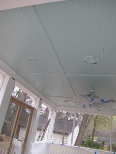 the inside of a house that is under construction with plastic covering it's windows