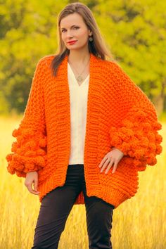 "----------READY TO SHIP by SuperTanya---------- Brand: SuperTanya; Style: hand knitted cardigan; Material: premium class soft baby yarn; Color: Orange Design: Chunky style Size & Measurements of the cardigan: Body length, measured from the shoulder top to the bottom end: 26\" / 66 cm; Chest width, measured at the back, between the underarms: 26\" / 66 cm; Sleeve length, measured from the underarm to the end of the cuff: 15.7\" / 40 cm *All measurements are taken with the item laid flat and not Handmade Yarn Cardigan For Fall, Winter Knitted Orange Outerwear, Orange Knitted Outerwear For Winter, Winter Orange Knitted Outerwear, Orange Chunky Knit Sweater For Winter, Spring Orange Knitted Cardigan, Cozy Orange Winter Cardigan, Orange Knitted Cardigan For Winter, Hand Knitted Orange Sweater For Fall