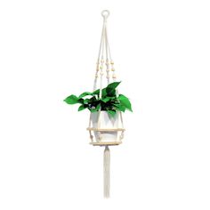 a white hanging planter with green leaves and beads on the end, attached to a rope