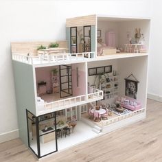 a doll house with furniture and accessories on the top floor in a living room area