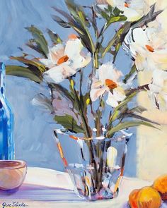 a painting of white flowers in a vase next to oranges and a blue bottle