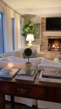 a living room filled with furniture and a fire place