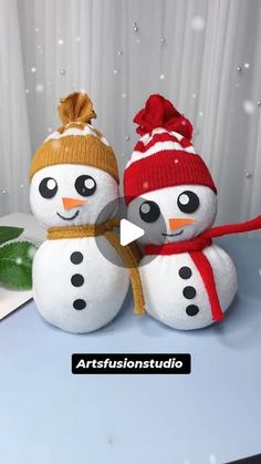 two snowmen are sitting next to each other