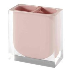 a pink vase sitting on top of a glass block