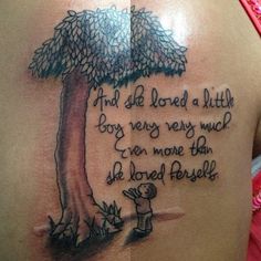 a woman's back with a tree tattoo on her shoulder and the words, and she loved a little boy very very much