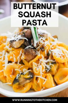 a white bowl filled with pasta covered in mushrooms and parmesan cheese text reads butternut squash pasta