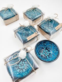 six blue glass coasters tied with twine