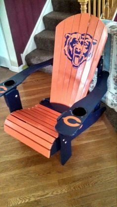 an orange and blue wooden chair with chicago bears logo on the back, in front of stairs