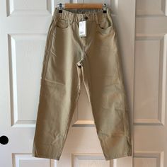 Nwt Tan Colored High Rise Pants From H&M. Ankle Length. Elastic Waist Band With Zipper And Button Closure. 100% Cotton. Size 8. Approximate Measurements: Waist - 13 Inches Rise - 12 Inches Length - 36 Inches Khaki Cropped Leg Pants With Pockets, H&m Casual Tapered Leg Pants, H&m Casual Ankle-length Pants, Khaki Pants With Button Closure For Spring, Casual H&m Straight Pants, Casual High Waist Spring Chinos, H&m Relaxed Fit Bottoms With Elastic Waistband, H&m Straight Leg Bottoms With Relaxed Fit, H&m Bottoms With Elastic Waistband And Relaxed Fit