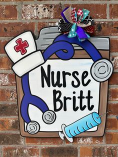 a sign on the side of a brick wall that says nurse britt with a stethoscope and medical supplies