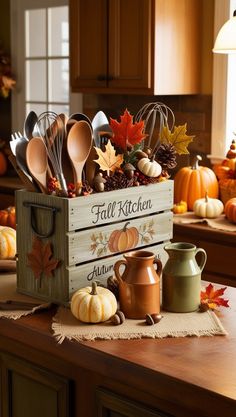 a wooden box filled with fall kitchen utensils