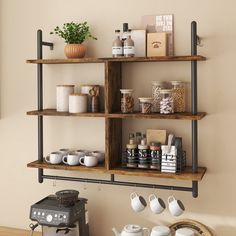 a shelf with coffee cups and mugs on it