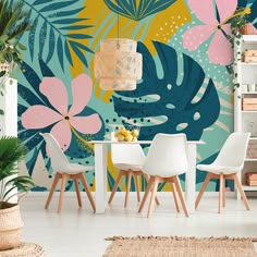 a dining room with tropical wallpaper and white chairs in front of a small table