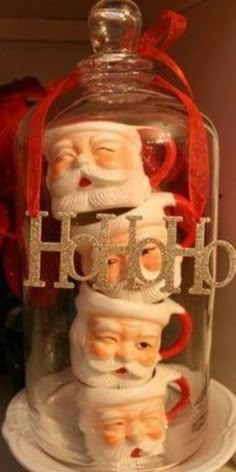 santa clause in a glass bell jar with red ribbon around his neck and the words hot on it