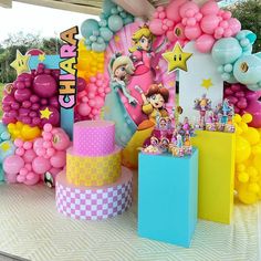 an outdoor birthday party with balloons and decorations