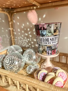 a wicker basket with assorted cookies and pastries on it, including an ice cream sundae