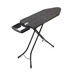 an ironing board is sitting on top of a black ironing board with a cord attached to it