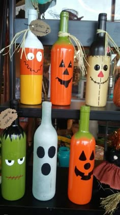 halloween bottles are lined up on a shelf