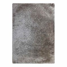 an area rug with grey fur on it