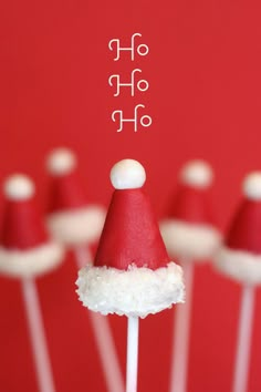 a group of santa hats sitting on top of lollipops