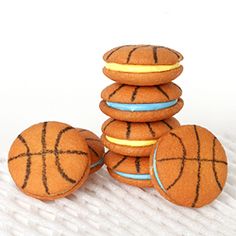 four basketball cookies stacked on top of each other with the words quick and easy basketball cookies