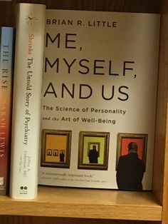 the book me, myself, and us is sitting on a bookshelf