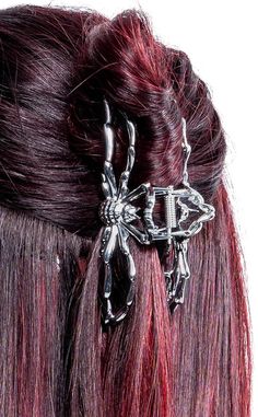 Keep your hair untangled with this metal hair claw clip.This gorgeous gothic claw clip features a silver spider ready to guard your hair against all attacks! With strong sturdy teeth to hold your gothic upstyle in place, this metal claw's grasp is strong enough to hold long and thick hair all day and night. For a simple but effective upstyle just twist your hair up, snap the clip in and adjust to your liking! Made from zinc alloy metal. Measurements: 11cm long x 4cm wide. Spider Hair, Gothic Hair Accessories, Long And Thick Hair, Gothic Hair, Web Spider, Gothic Hairstyles, Hair Claw Clip, Metal Hair, Metallic Hair