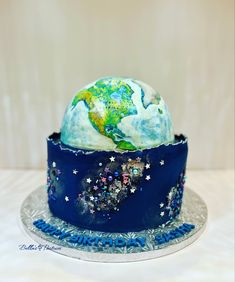 a cake decorated with the earth and stars