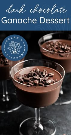 two glasses filled with chocolate ganache desserts on top of a black countertop