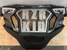 the letters rzr kid are made out of metal