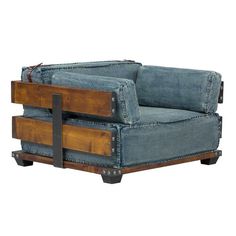 a chair made out of old jeans with wooden legs and two drawers on each side