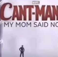 a man standing in front of a giant sign that says can't - man my mom said no