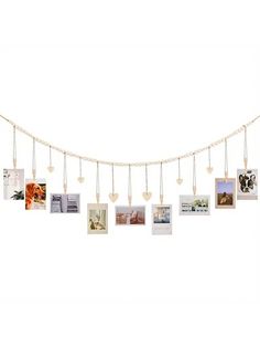 a string with pictures hanging from it's sides and hearts attached to the strings