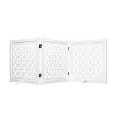 a white room divider with an intricate design