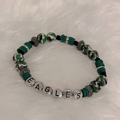 a bracelet with the word eagles on it