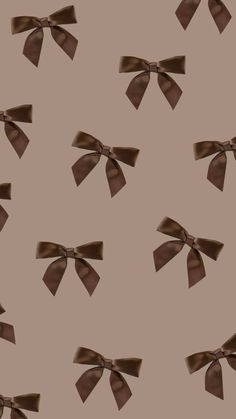 an image of brown bows on a beige background