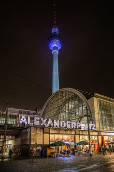 the building is lit up with blue lights