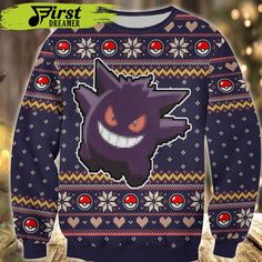 a sweater with an image of the pokemon character on it, in front of a christmas tree