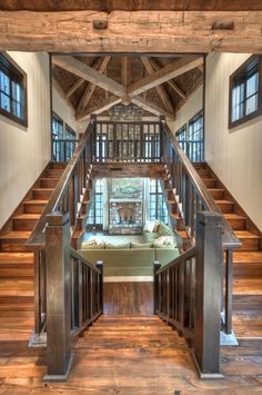 the inside of a house with wooden floors and stairs