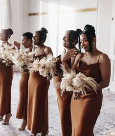 the bridesmaids are all dressed in brown