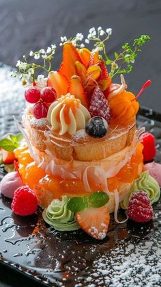 a multi layered cake with fresh fruit on top