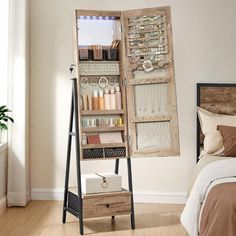 a bedroom with a bed and an old wooden cabinet in the corner next to it