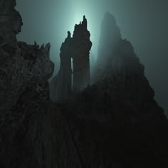 an old ruin in the middle of a foggy mountain range with tall spires