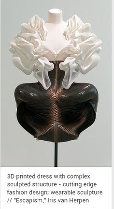 a white and black sculpture sitting on top of a table