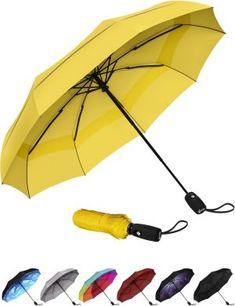 an open umbrella with multiple colors on it and the handle is attached to each other