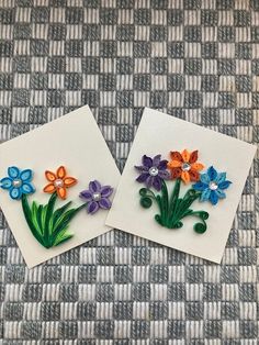 two pieces of paper with flowers on them